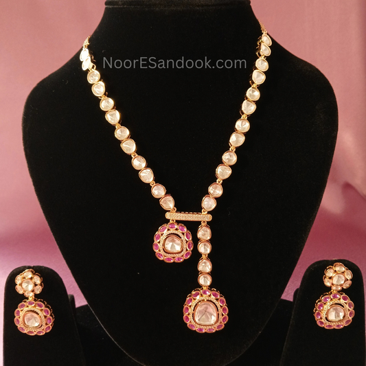 One small and one big pendant in long necklace