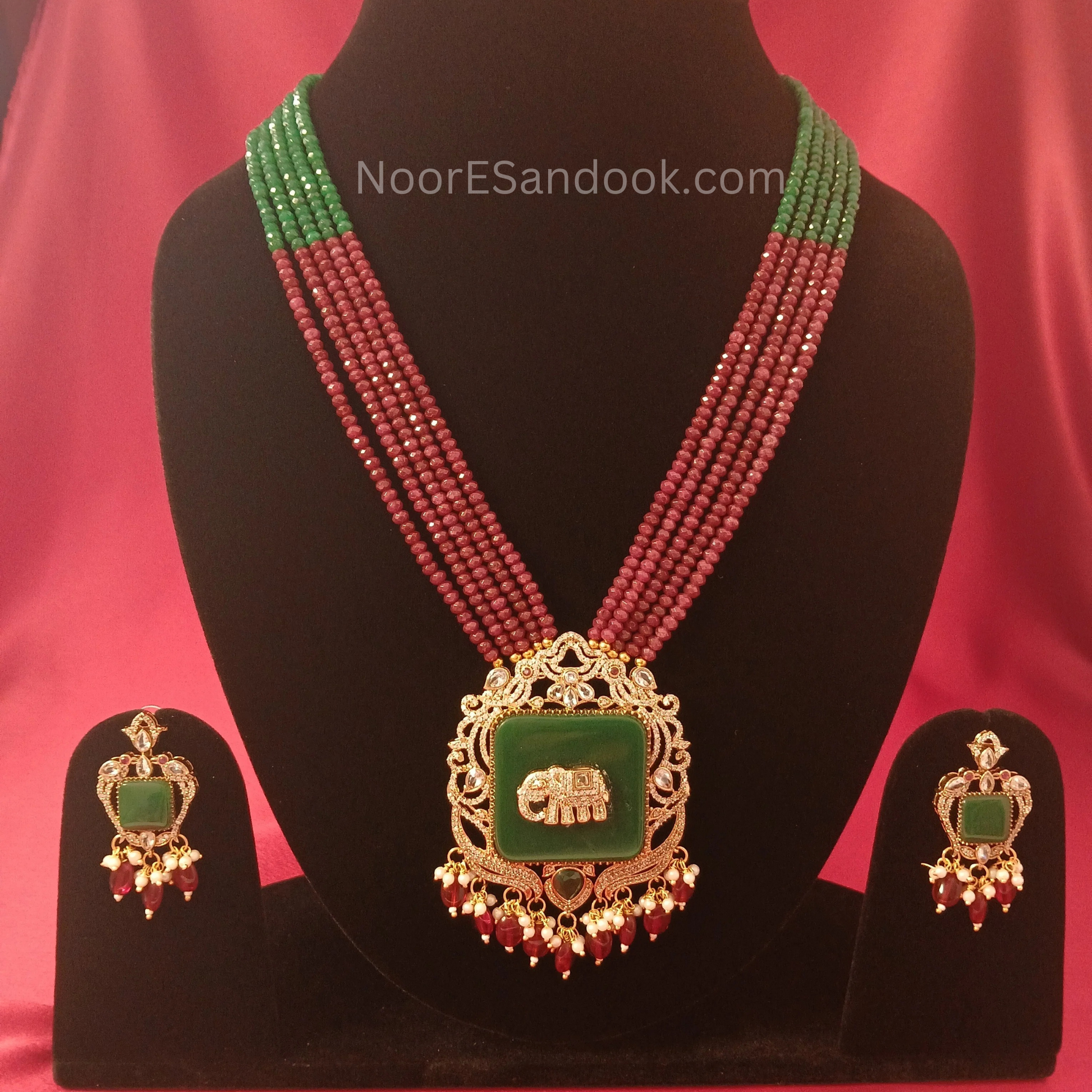 Elephant carved stone with long necklace