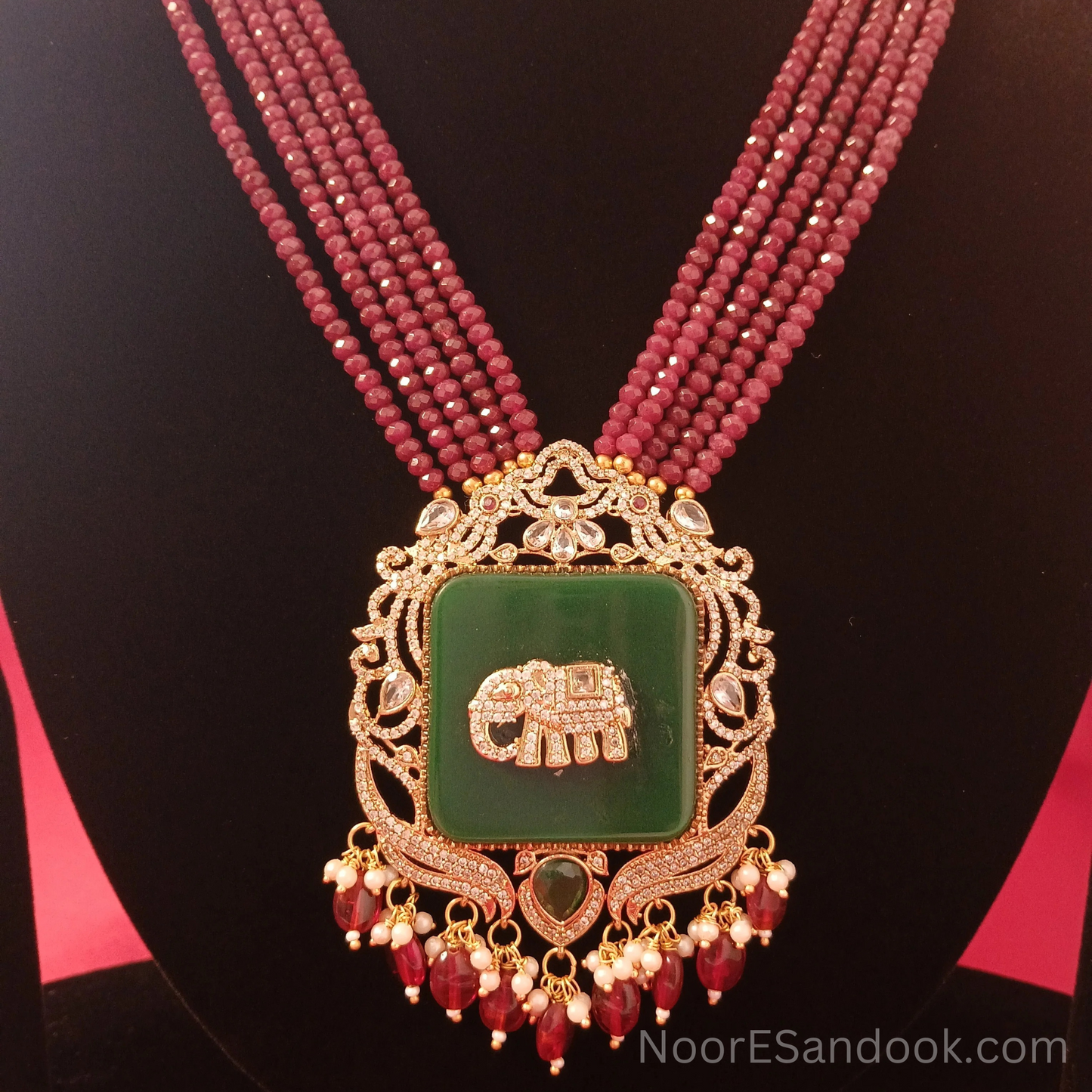 Elephant carved stone with long necklace