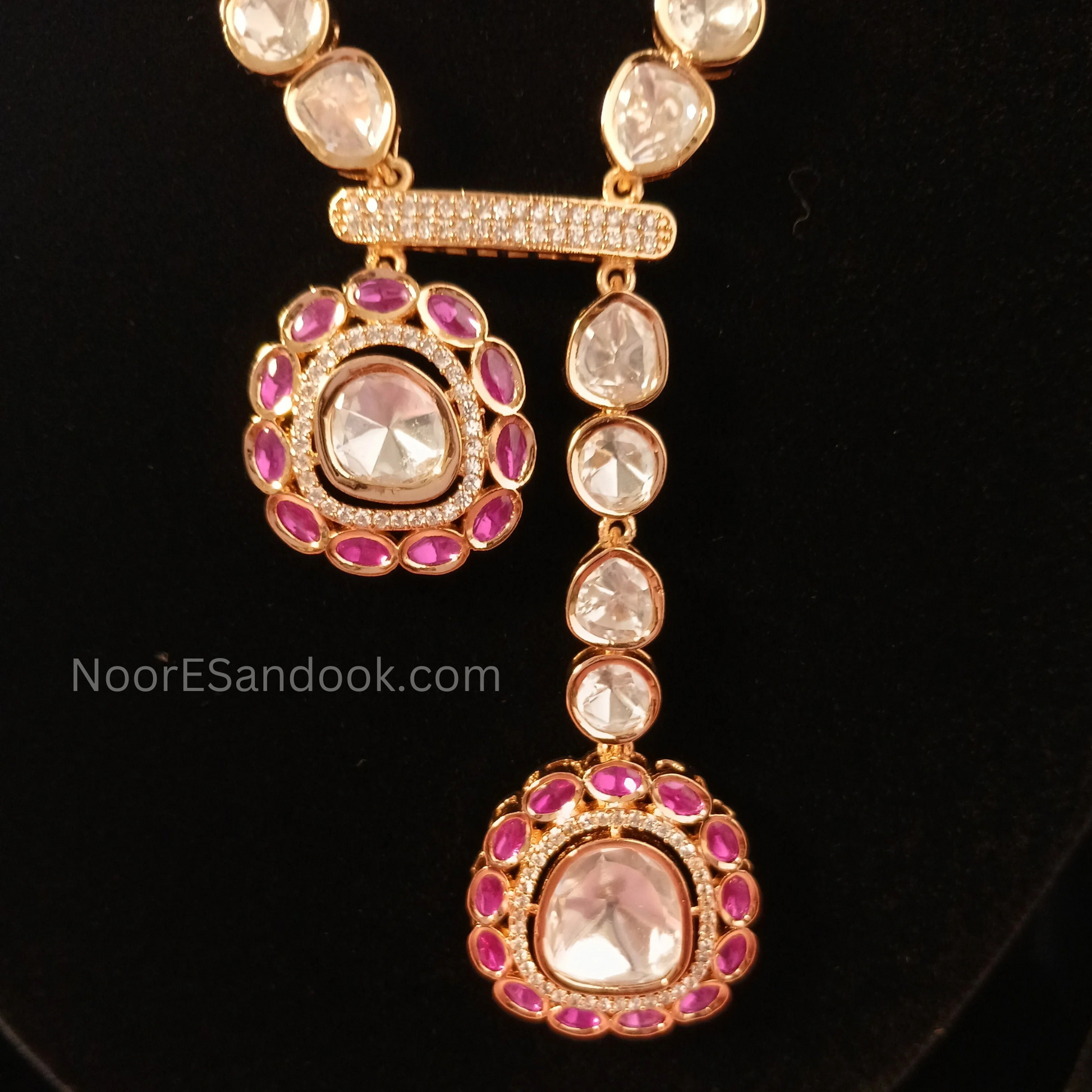 One small and one big pendant in long necklace
